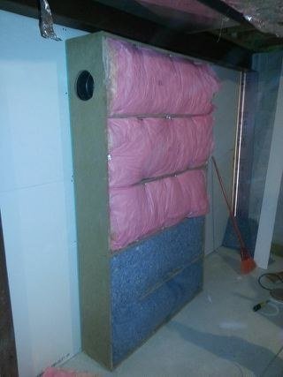 Fully packed, denser material at the base where it does the most good. Absorption is a depth problem, which is why this is the thickness it is.