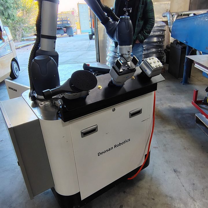 Cobot on a mobile cart — deployable to a station rather than fixed to one. Flexible, and a fresh set of problems.