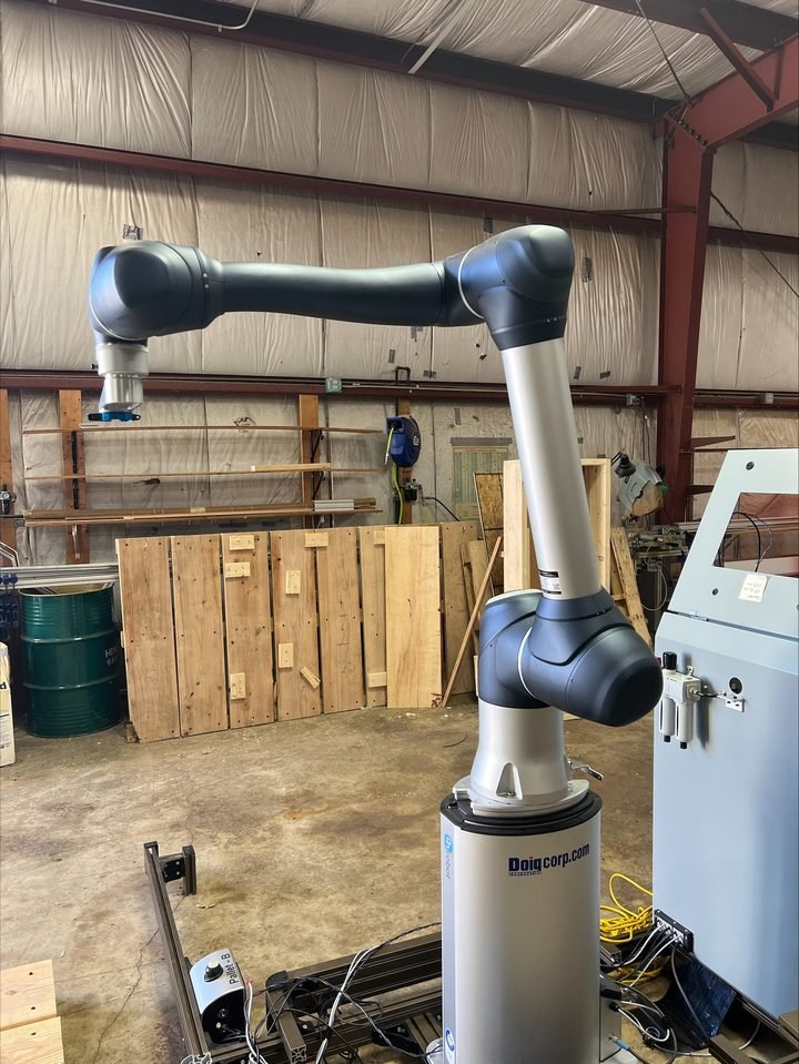 Collaborative arm in the shop. Different safety philosophy, different speed budget, entirely different conversation with the customer.