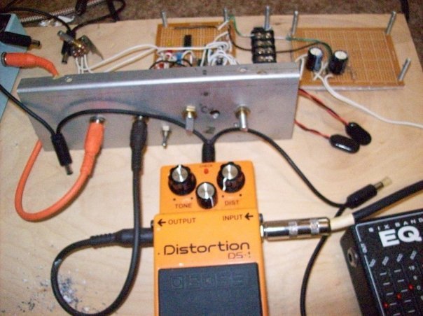 On the bench next to a factory pedal. Having a known-good reference in reach settles arguments the meter can't.