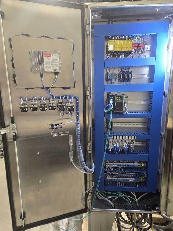 Stainless enclosure — washdown environment. Costs more, survives the hose.