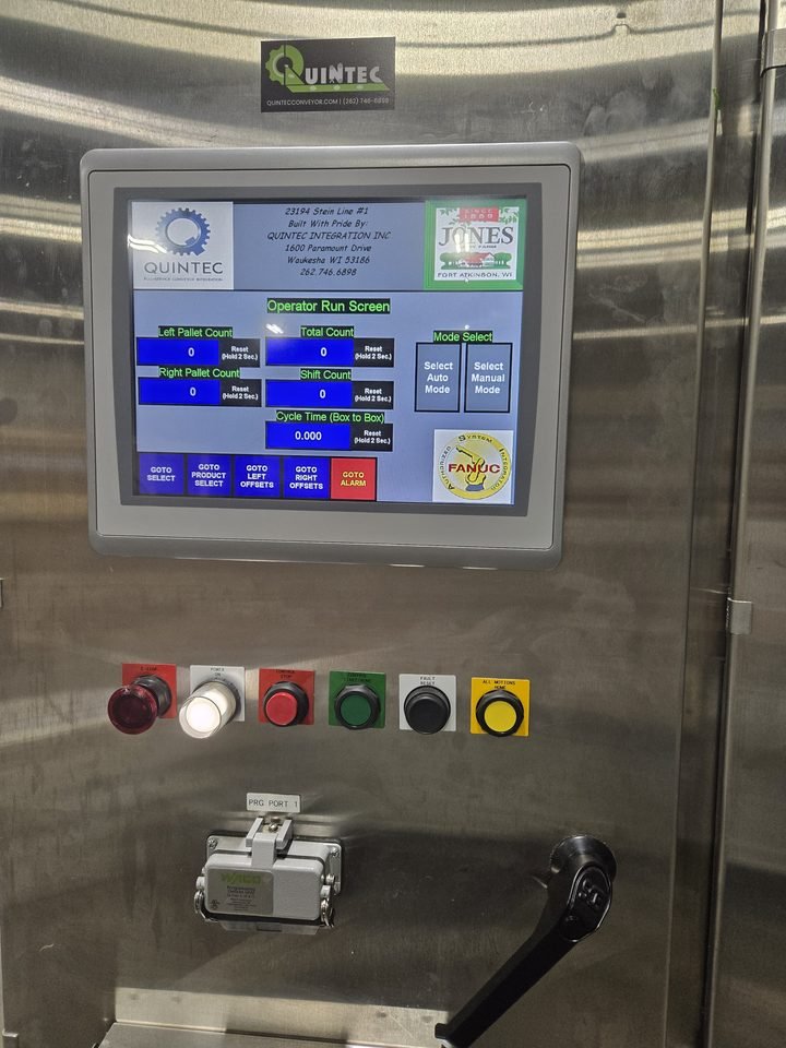 Touchscreen station with the hard-wired emergency stop kept separate, where it belongs. Safety does not go through the screen.