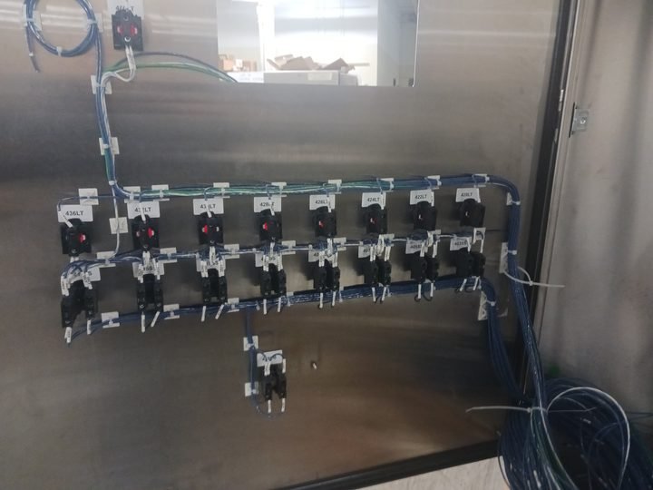 Contactors racked and fed. Repetition is its own kind of quality control — a wrong one is visible instantly.