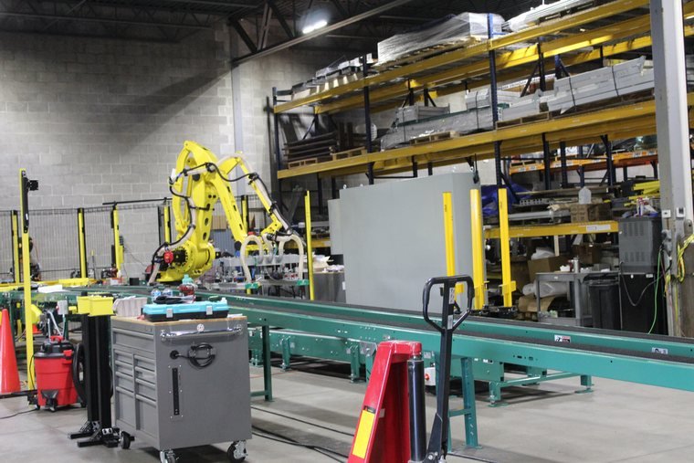 Same line from the other end. The green conveyor is the thread everything else is hung on.